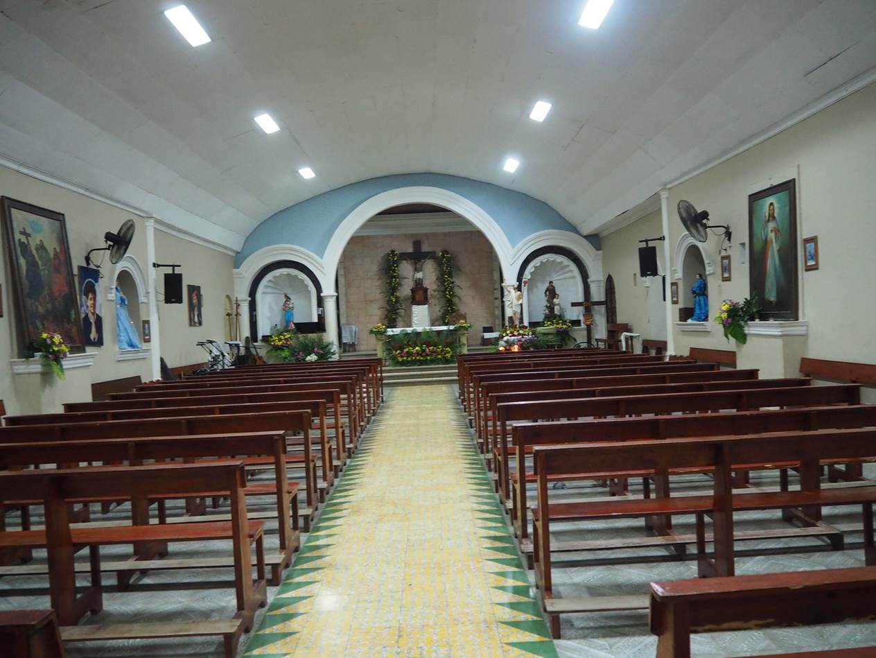 A church with benches and a cross

AI-generated content may be incorrect.