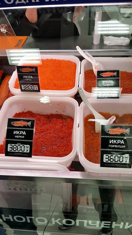 A picture containing sitting, food, table, covered

Description automatically generated